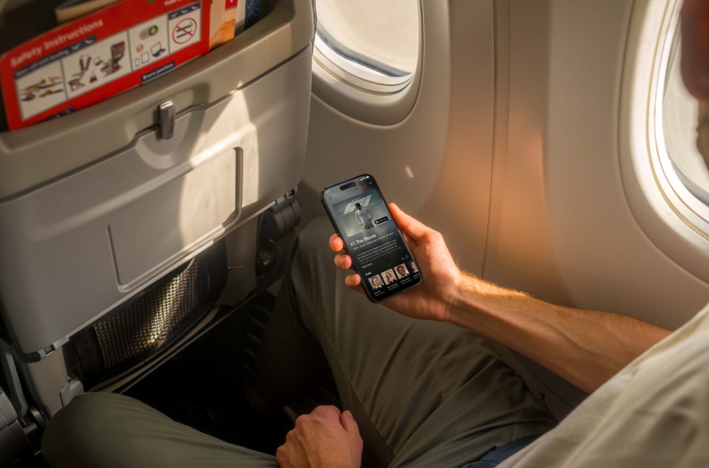 IFE in context — passenger using InFlight Entertainment on aircraft
